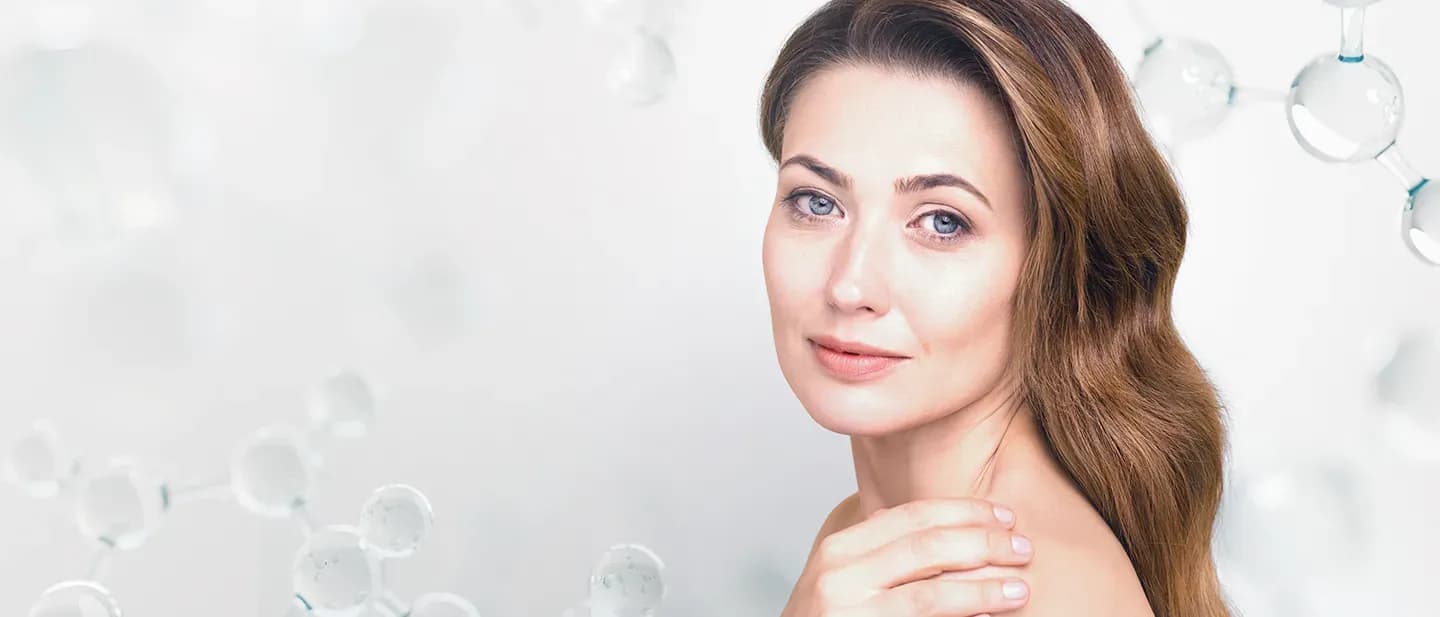 Woman with flawless skin protected by DIBI Milano Solarium sunscreen, featured by The Vintage Avenue Skin Clinic.