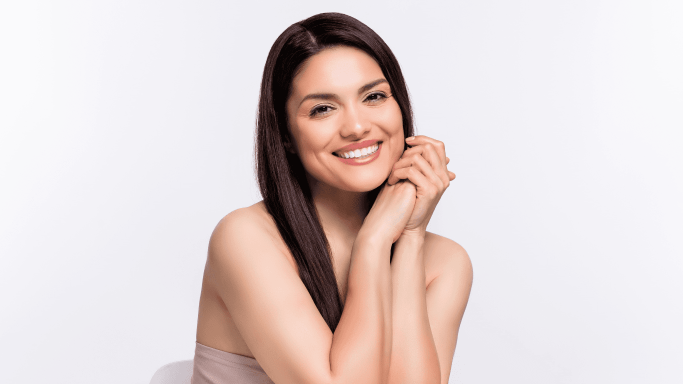 Smiling woman with rich brunette hair colour, styled at The Vintage Avenue Hair & Beauty Salon in Biggleswade