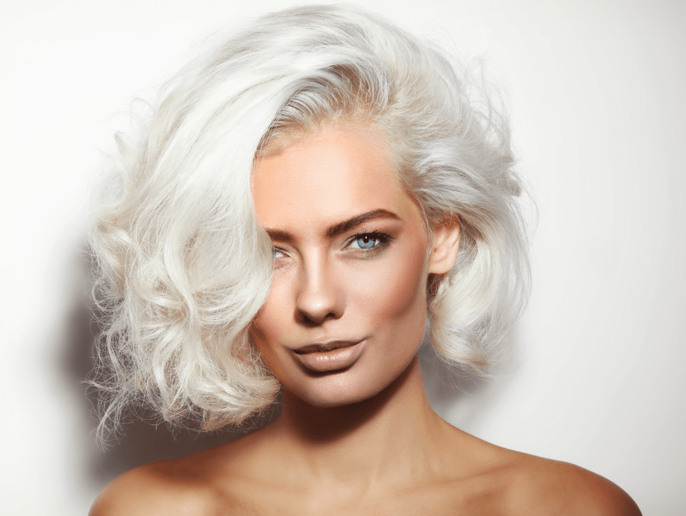 Woman with a softly styled platinum blonde bob and icy tone, showcasing Full Head Bleach & Tone results – The Vintage Avenue, Biggleswade
