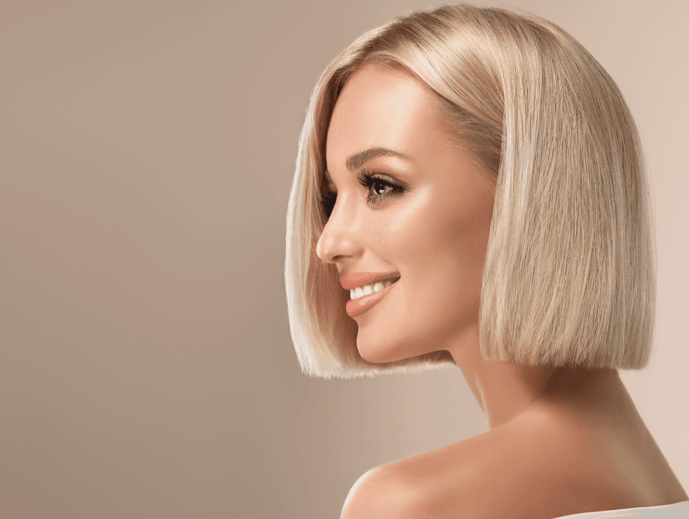 Woman with sleek, cool-toned blonde hair in a precision bob, showcasing subtle Half Head Babylights for a soft, radiant finish – The Vintage Avenue, Biggleswade