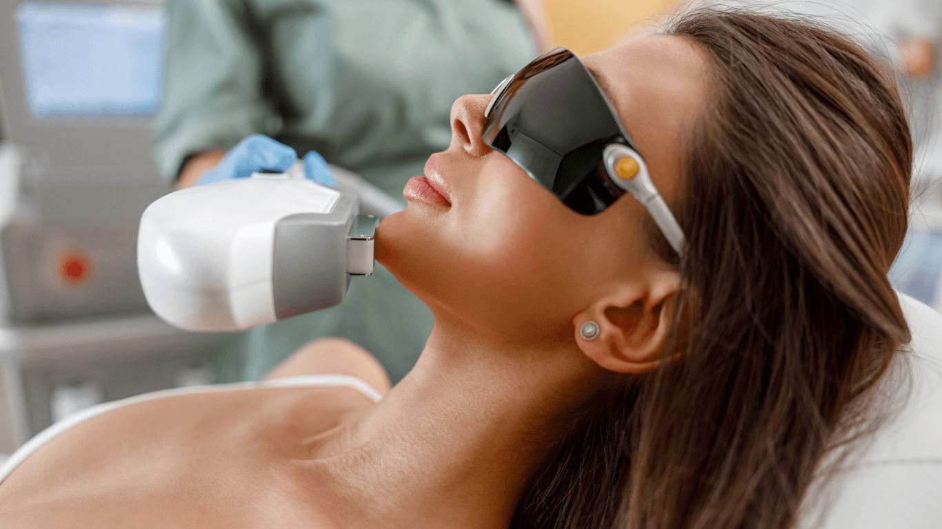 Woman receiving IPL hair removal or skin rejuvenation treatment at The Vintage Avenue in Biggleswade, wearing protective eyewear