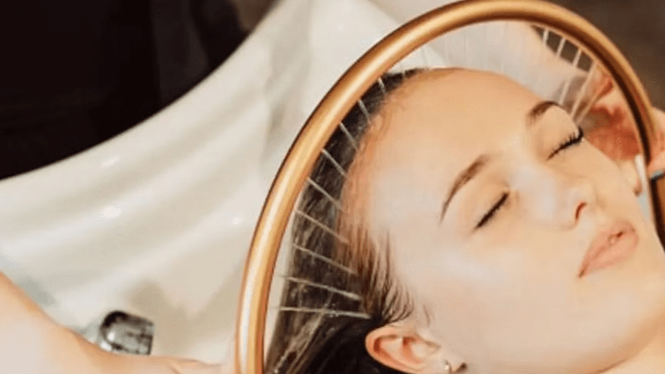 Woman enjoying a luxury Japanese head spa treatment at The Vintage Avenue in Biggleswade with water therapy for scalp and relaxation