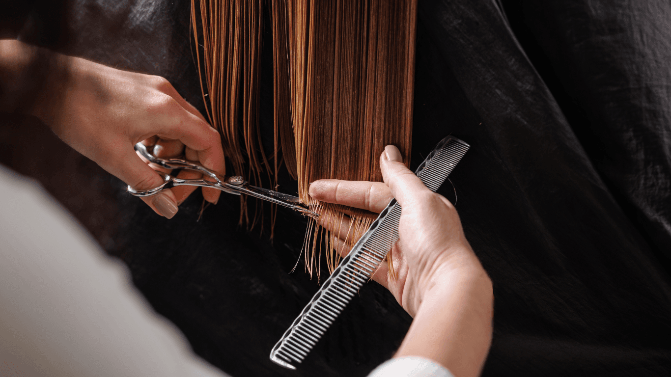 Hairdresser performing a precision haircut at The Vintage Avenue salon in Biggleswade