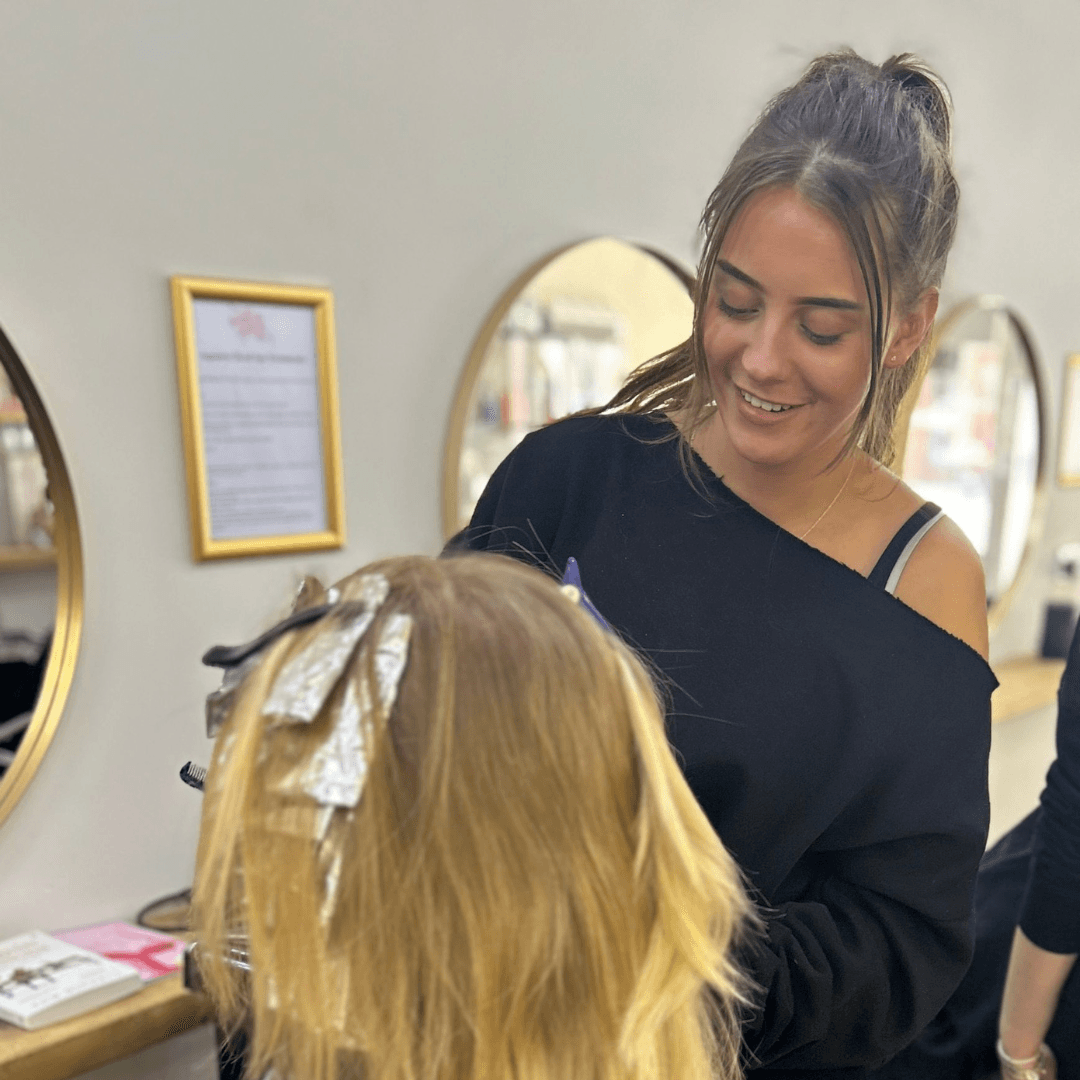 Jayne, colour technician at Vintage Avenue, applying foils for highlights on a client