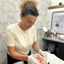 Natasha, skincare specialist at Vintage Avenue, delivering a professional facial treatment in the beauty room